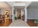 Grand foyer with high ceilings, tile entryway, hardwood flooring, and views into the kitchen and living areas at 814 Sunny Field Ln, Lawrenceville, GA 30043