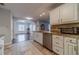 Bright kitchen with granite countertops, stainless steel appliances, and a view into the Gathering room at 814 Sunny Field Ln, Lawrenceville, GA 30043