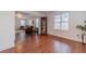 Open-concept room showcases beautiful hardwood floors and a large window providing ample natural light at 814 Sunny Field Ln, Lawrenceville, GA 30043