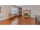 Inviting living room with fireplace, wood floors, and two comfortable chairs at 814 Sunny Field Ln, Lawrenceville, GA 30043