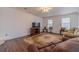 Comfortable Gathering room features a plush rug, and neutral walls, creating a relaxing atmosphere for gatherings at 814 Sunny Field Ln, Lawrenceville, GA 30043