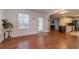 Inviting room with hardwood floors, large window, and rear door to outside space at 814 Sunny Field Ln, Lawrenceville, GA 30043
