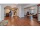 Spacious living area with hardwood floors connecting the kitchen and Gathering room, creating an inviting and open atmosphere at 814 Sunny Field Ln, Lawrenceville, GA 30043