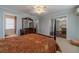 Spacious primary bedroom featuring a ceiling fan, sitting area, and ensuite bath at 814 Sunny Field Ln, Lawrenceville, GA 30043