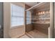 Modern walk-in shower featuring beautiful tiling and a glass enclosure at 814 Sunny Field Ln, Lawrenceville, GA 30043