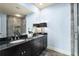 The bathroom features a double vanity with black countertops and a glass enclosed shower at 2057 Telfair Cir, Atlanta, GA 30324