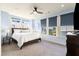 Serene bedroom with light blue walls, large windows, and a comfortable queen-sized bed at 2057 Telfair Cir, Atlanta, GA 30324