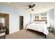 Bedroom features a ceiling fan, comfortable bed with 'LOVE' pillow, and a view out the window at 2057 Telfair Cir, Atlanta, GA 30324