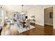 Bright dining room featuring a modern chandelier, hardwood floors, and open-concept layout at 2057 Telfair Cir, Atlanta, GA 30324