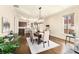 Elegant dining room with stylish chandelier, hardwood floors, and views into the kitchen at 2057 Telfair Cir, Atlanta, GA 30324
