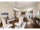 Dining room with modern chandelier, hardwood floors, and open concept to the kitchen at 2057 Telfair Cir, Atlanta, GA 30324