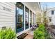Charming home featuring a welcoming front porch, stone steps, and a 