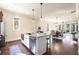 Open-concept kitchen with granite countertops, stainless steel appliances, and a view into the dining area at 2057 Telfair Cir, Atlanta, GA 30324