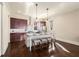 Spacious kitchen with dark wood cabinets, stainless steel appliances, and a large island with seating at 2057 Telfair Cir, Atlanta, GA 30324