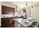 Kitchen featuring dark wood cabinets, stainless steel appliances, granite countertops and a center island at 2057 Telfair Cir, Atlanta, GA 30324