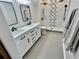 Elegant bathroom with double vanity, marble countertops, and a walk-in shower at 4320 Center Hill Church Rd, Loganville, GA 30052