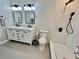 Modern bathroom featuring a double vanity, updated fixtures, and a shower at 4320 Center Hill Church Rd, Loganville, GA 30052
