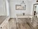 Farmhouse-style dining room with a large table and chandelier at 4320 Center Hill Church Rd, Loganville, GA 30052