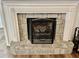 Stone fireplace with a black metal screen at 4320 Center Hill Church Rd, Loganville, GA 30052