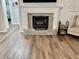 Cozy stone fireplace in living room with hardwood floors at 4320 Center Hill Church Rd, Loganville, GA 30052