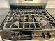 Stainless steel Frigidaire gas cooktop with multiple burners at 4320 Center Hill Church Rd, Loganville, GA 30052