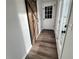 Hallway with barn door and hardwood floors at 4320 Center Hill Church Rd, Loganville, GA 30052