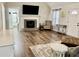 Spacious living room with hardwood floors and a stone fireplace at 4320 Center Hill Church Rd, Loganville, GA 30052