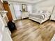 Spacious main bedroom with king-size bed and LVP flooring at 4320 Center Hill Church Rd, Loganville, GA 30052