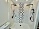 Large walk-in shower with dual shower heads and patterned tile at 4320 Center Hill Church Rd, Loganville, GA 30052