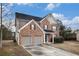 Beautiful two-story brick home with a two car garage, manicured lawn and lovely curb appeal at 436 Margaux Way, Atlanta, GA 30349