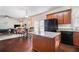 Open kitchen with granite counters, island and stainless steel appliances at 436 Margaux Way, Atlanta, GA 30349