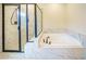 Spa-like bathroom with a large walk-in shower and soaking tub at 776 Clifftop Crossing, Powder Springs, GA 30127
