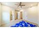 Spacious bedroom with ceiling fan, carpet, and access to bathroom at 776 Clifftop Crossing, Powder Springs, GA 30127