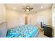 Bedroom featuring a ceiling fan, cozy carpet, and natural light from the window at 776 Clifftop Crossing, Powder Springs, GA 30127
