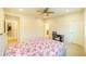Cozy bedroom with an open closet and bathroom, ceiling fan, and carpet at 776 Clifftop Crossing, Powder Springs, GA 30127