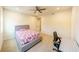 Inviting bedroom with plush carpet, ceiling fan, and a comfortable bed at 776 Clifftop Crossing, Powder Springs, GA 30127