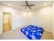 Bright bedroom with ceiling fan and carpeted floor at 776 Clifftop Crossing, Powder Springs, GA 30127