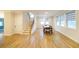 Bright dining room with hardwood floors and a view of the staircase at 776 Clifftop Crossing, Powder Springs, GA 30127