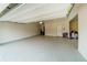 Spacious two-car garage with epoxy flooring and open ceiling at 776 Clifftop Crossing, Powder Springs, GA 30127