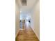 Hallway featuring hard wood floors leading to bedrooms, and stairs at 776 Clifftop Crossing, Powder Springs, GA 30127