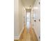 Hallway with light hardwood floors and white doors at 776 Clifftop Crossing, Powder Springs, GA 30127