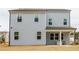 Two-story house with gray siding, covered patio, and a spacious backyard at 776 Clifftop Crossing, Powder Springs, GA 30127