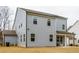Two-story house with gray siding, covered patio, and a spacious backyard at 776 Clifftop Crossing, Powder Springs, GA 30127