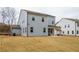 Two story house with gray siding, covered patio, and a spacious backyard at 776 Clifftop Crossing, Powder Springs, GA 30127