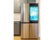 Stainless steel refrigerator with integrated touchscreen display at 776 Clifftop Crossing, Powder Springs, GA 30127