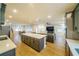 Modern kitchen with gray cabinets, quartz countertops, and stainless steel appliances at 776 Clifftop Crossing, Powder Springs, GA 30127