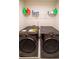 Laundry room with LG washer and dryer, and shelving at 776 Clifftop Crossing, Powder Springs, GA 30127