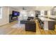 Spacious living area with hardwood floors, sectional sofa, and fireplace at 776 Clifftop Crossing, Powder Springs, GA 30127