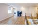 Bright living area with hardwood floors, neutral walls, and modern windows with shades, plus a staircase at 776 Clifftop Crossing, Powder Springs, GA 30127