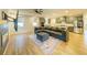 Living area with sectional sofa, hardwood floors, fireplace, and built-in TV mount at 776 Clifftop Crossing, Powder Springs, GA 30127